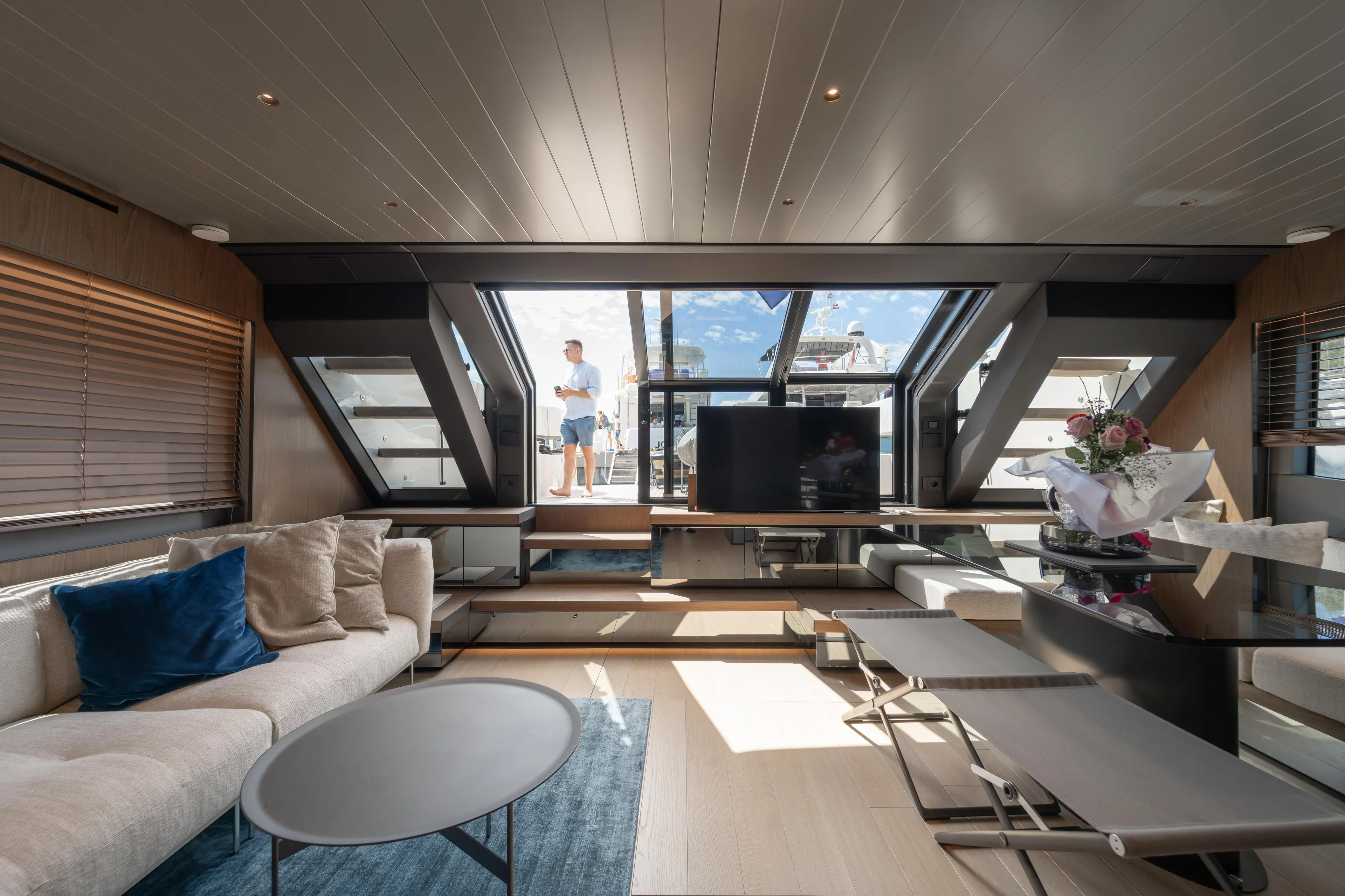  Yacht Photos Pics Luxurious interior of 2025 Bluegame BG74 yacht with modern furnishings and panoramic windows.
