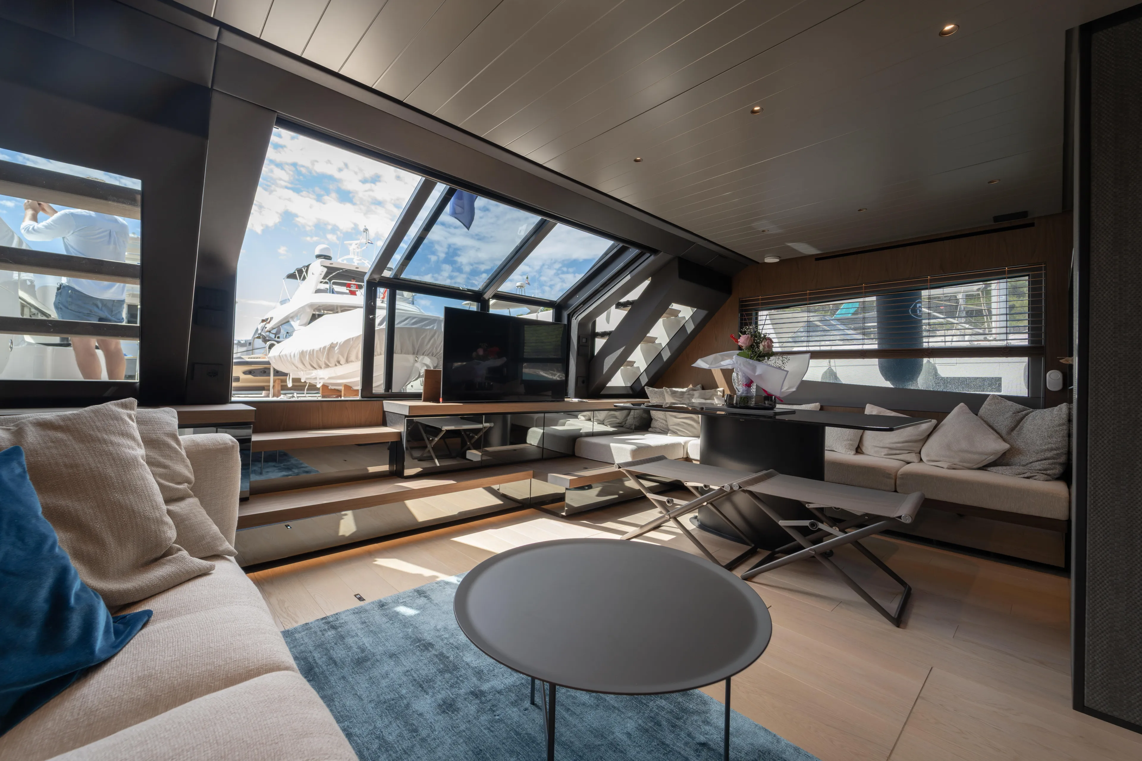  Yacht Photos Pics Luxurious interior of 2025 Bluegame BG74 yacht with modern furnishings and panoramic windows.