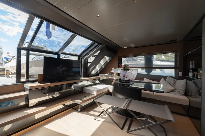  Yacht Photos Pics Luxurious interior of 2025 Bluegame BG74 yacht with modern seating and large windows.