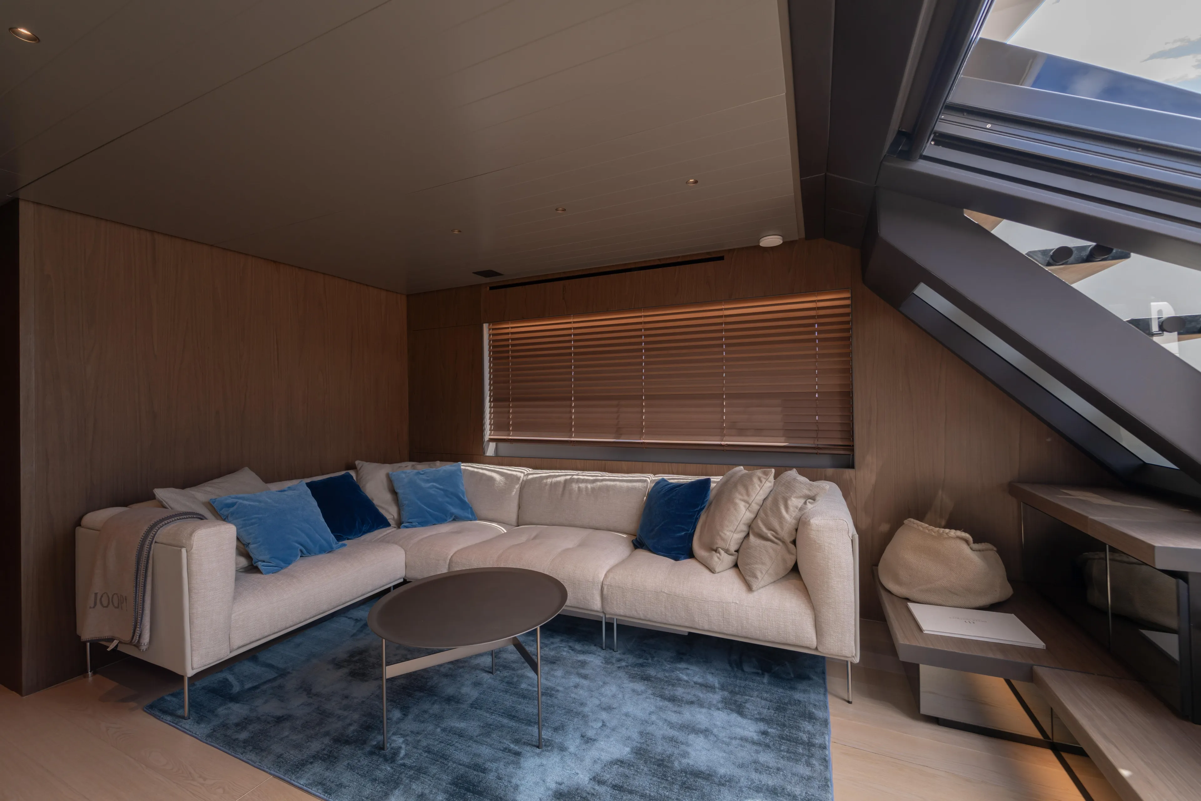  Yacht Photos Pics Luxurious interior of 2025 Bluegame BG74 yacht with modern sofa and elegant decor.