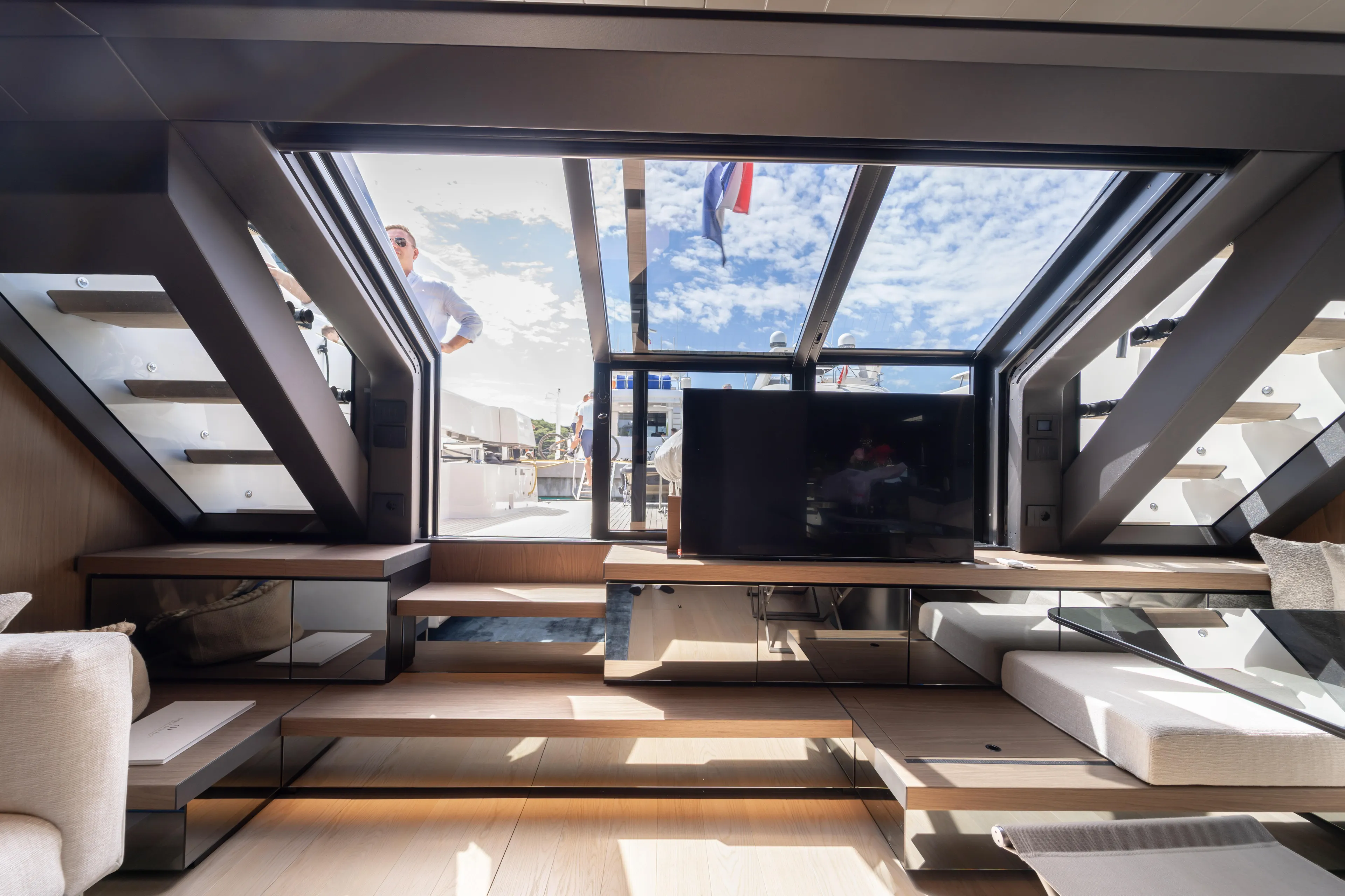  Yacht Photos Pics Luxurious interior of 2025 Bluegame BG74 yacht with modern design and panoramic windows.