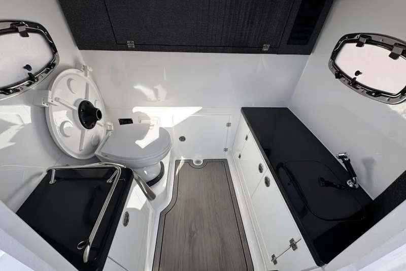  Yacht Photos Pics 2026 Monterey Elite 27 OB boat interior with modern bathroom amenities.