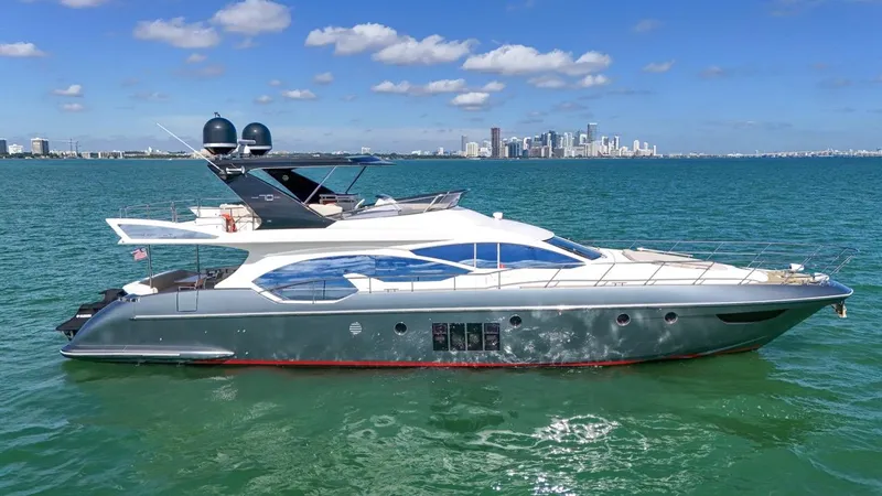  Yacht Photos Pics Luxurious 2012 Azimut Flybridge yacht cruising on clear blue waters.