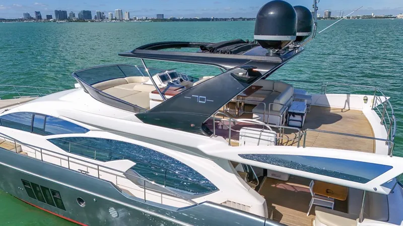  Yacht Photos Pics Luxurious 2012 Azimut Flybridge yacht cruising on serene waters.
