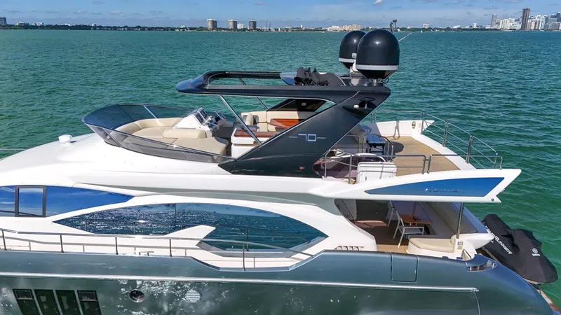  Yacht Photos Pics Luxurious 2012 Azimut Flybridge yacht cruising on serene waters.