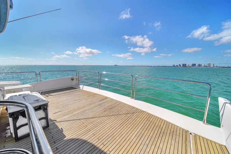  Yacht Photos Pics Azimut Flybridge 2012 yacht deck with ocean view and clear blue sky.