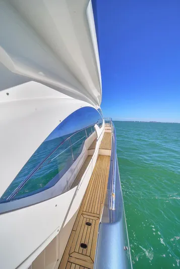  Yacht Photos Pics Azimut Flybridge 2012 yacht cruising on clear blue waters under a bright sky.