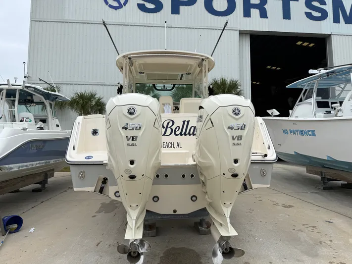  Yacht Photos Pics 2025 Grady-White Express 330 boat with twin Yamaha 450 V8 engines at a marina.