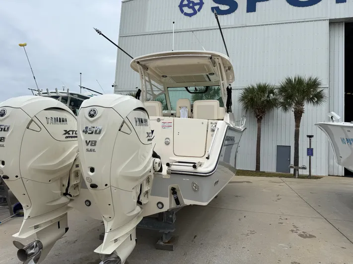  Yacht Photos Pics 2025 Grady-White Express 330 boat with twin Yamaha 450 engines at a marina.