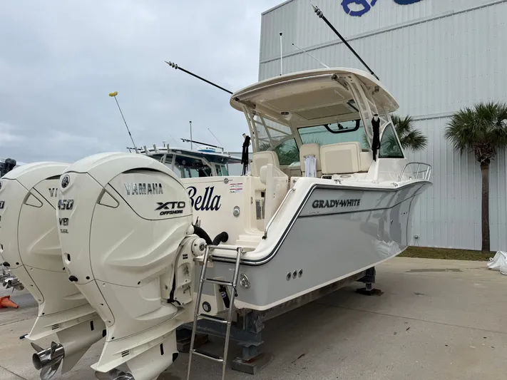  Yacht Photos Pics 2025 Grady-White Express 330 boat with Yamaha XTO engines, docked outdoors.