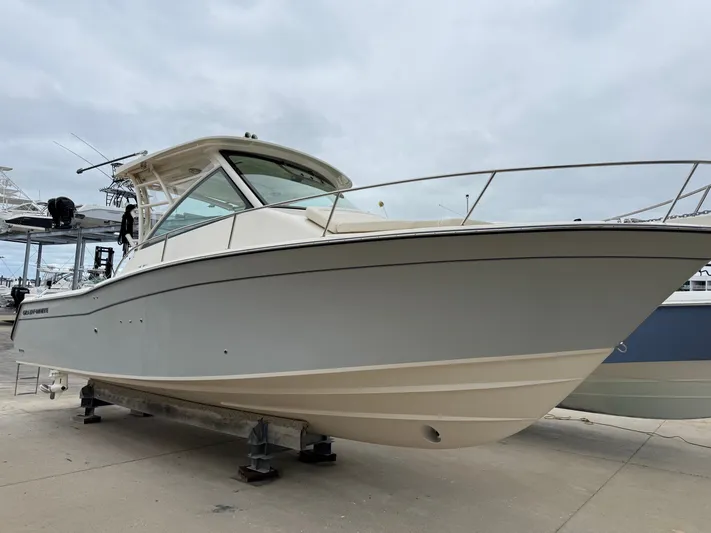  Yacht Photos Pics 2025 Grady-White Express 330 boat on display at a marina.