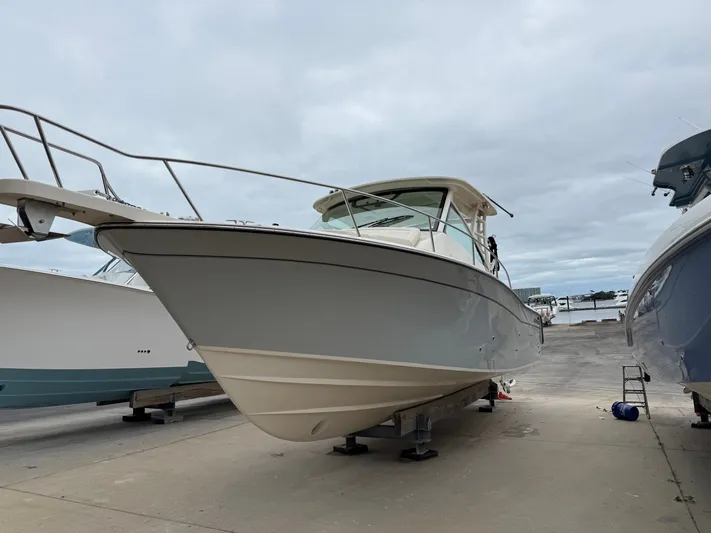  Yacht Photos Pics 2025 Grady-White Express 330 boat on display at a marina.