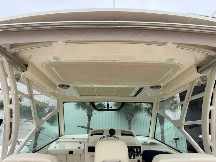  Yacht Photos Pics 2025 Grady-White Express 330 boat interior with helm and panoramic windows.