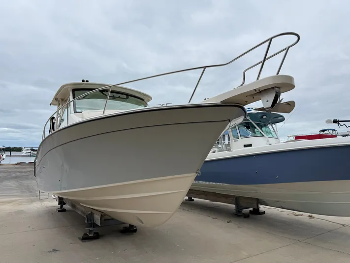  Yacht Photos Pics 2025 Grady-White Express 330 boat on display at a marina.