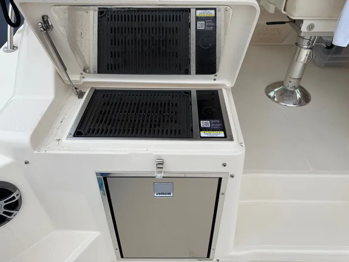  Yacht Photos Pics Outdoor grill and storage on 2025 Grady-White Express 330 boat.