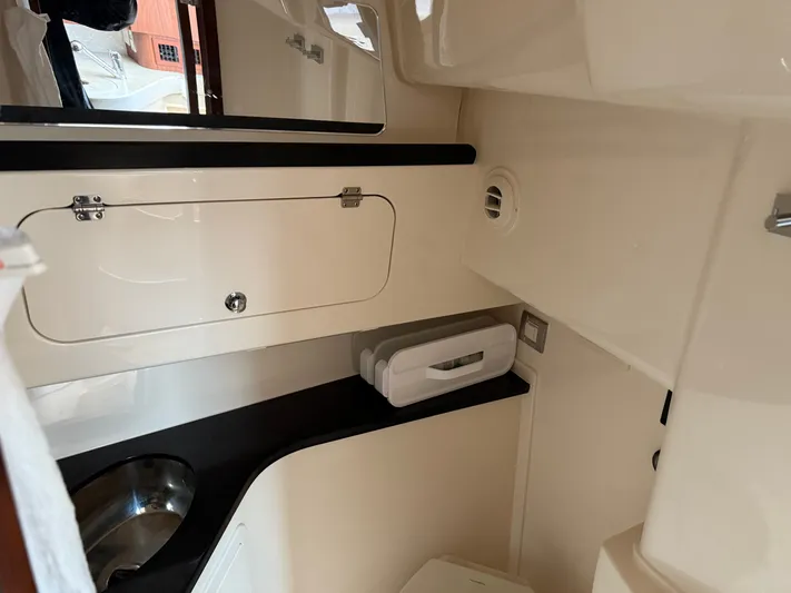  Yacht Photos Pics 2025 Grady-White Express 330 boat interior, featuring a compact and modern bathroom design.