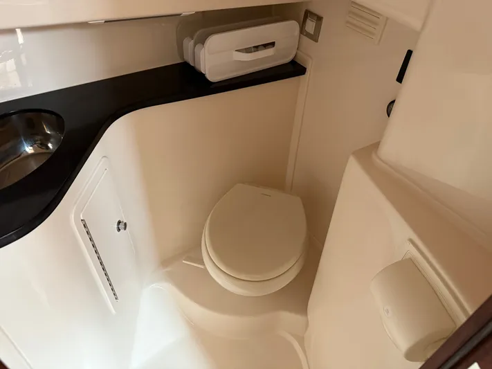  Yacht Photos Pics 2025 Grady-White Express 330 boat bathroom with modern fixtures and compact design.