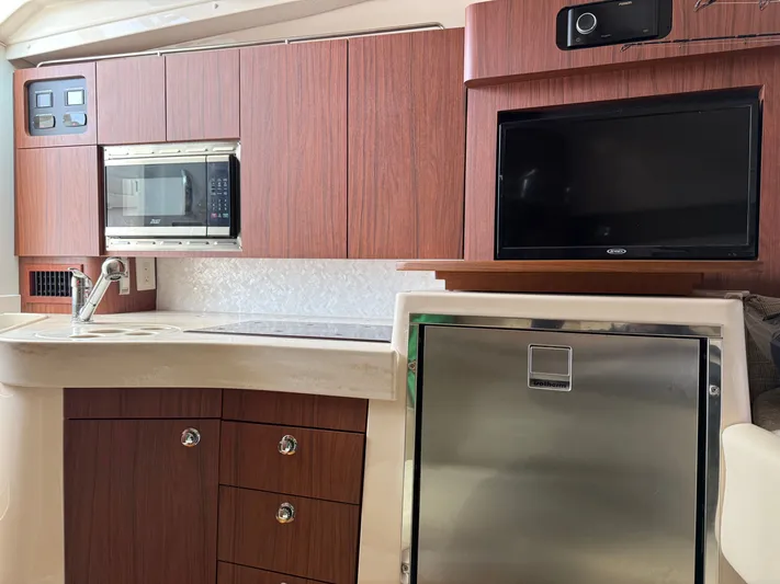  Yacht Photos Pics 2025 Grady-White Express 330 interior with modern kitchen appliances and sleek cabinetry.