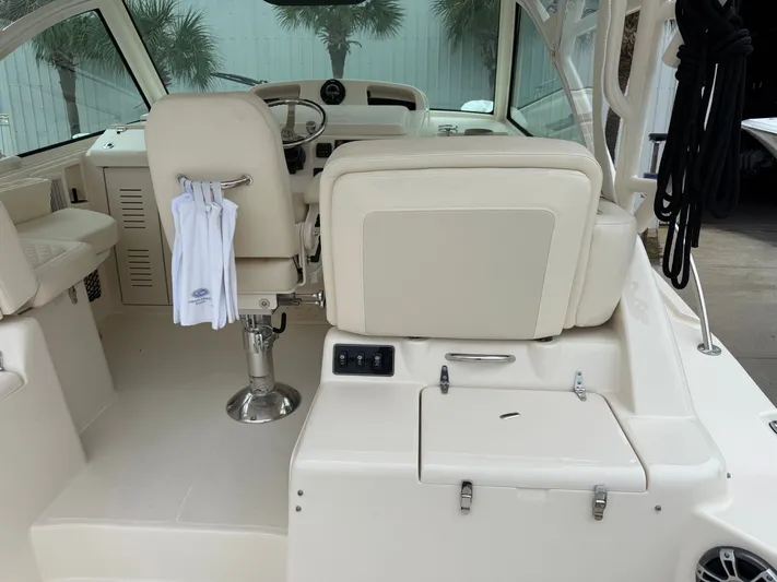 Yacht Photos Pics 2025 Grady-White Express 330 boat interior with helm and seating area.