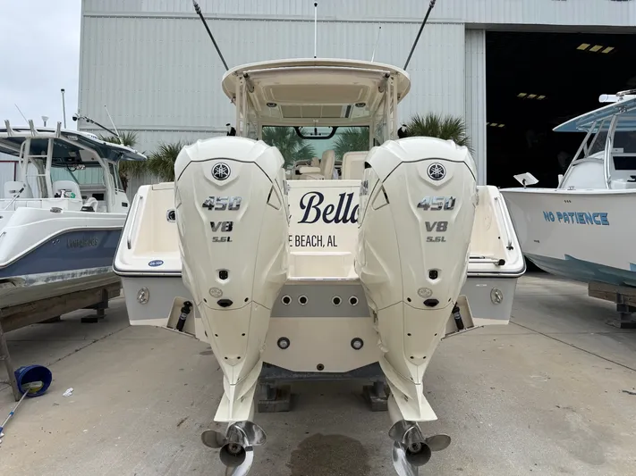  Yacht Photos Pics 2025 Grady-White Express 330 boat with twin Yamaha 450 V8 engines at a marina.