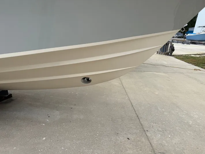  Yacht Photos Pics 2025 Grady-White Express 330 boat hull on concrete surface.