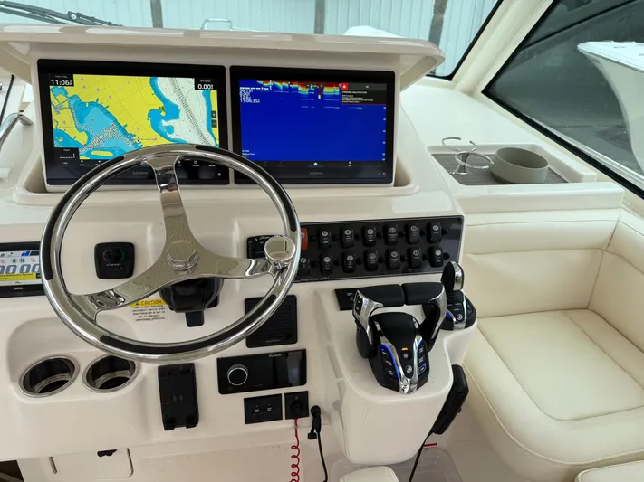  Yacht Photos Pics Helm of 2025 Grady-White Express 330 with dual displays and modern controls.