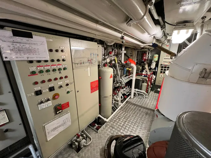 Sanssouci Star Yacht Photos Pics Engine room of 1982 Custom Displacement Twin Screw with control panels and machinery.