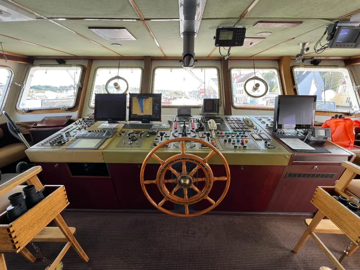 Sanssouci Star Yacht Photos Pics Bridge of 1982 Custom Displacement Twin Screw ship with navigation equipment and wooden wheel.