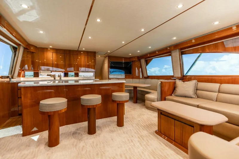 Miss Virginia Yacht Photos Pics Luxurious interior of 2017 Viking 66 Convertible yacht with elegant seating and wooden finishes.