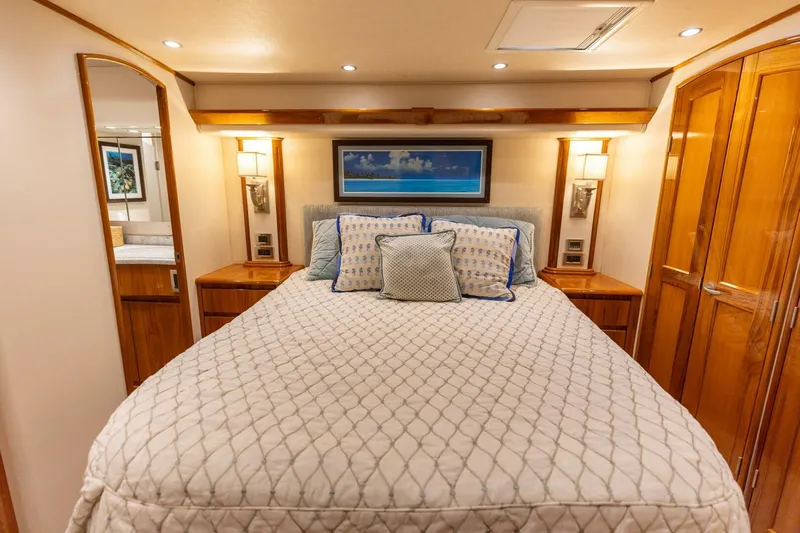 Miss Virginia Yacht Photos Pics Luxurious bedroom interior of 2017 Viking 66 Convertible yacht with elegant wood finishes.