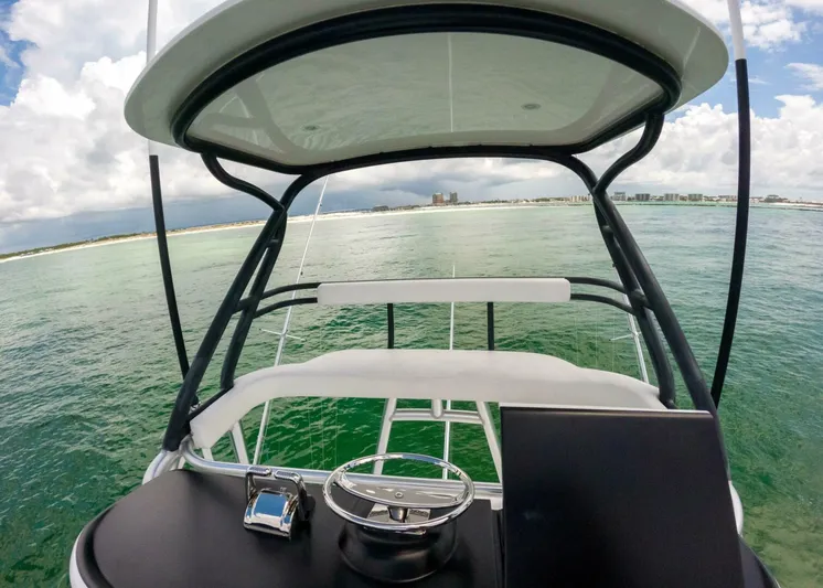 Miss Virginia Yacht Photos Pics 2017 Viking 66 Convertible yacht helm with ocean view and distant shoreline.