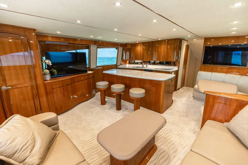 Miss Virginia Yacht Photos Pics Luxurious interior of 2017 Viking 66 Convertible yacht with elegant wood finishes and modern amenities.