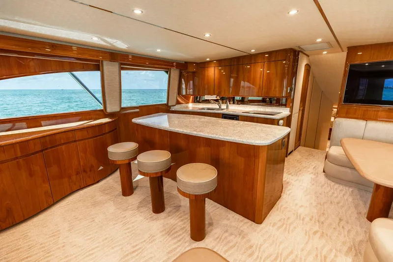 Miss Virginia Yacht Photos Pics Luxurious interior of 2017 Viking 66 Convertible yacht with elegant wood finishes and ocean view.