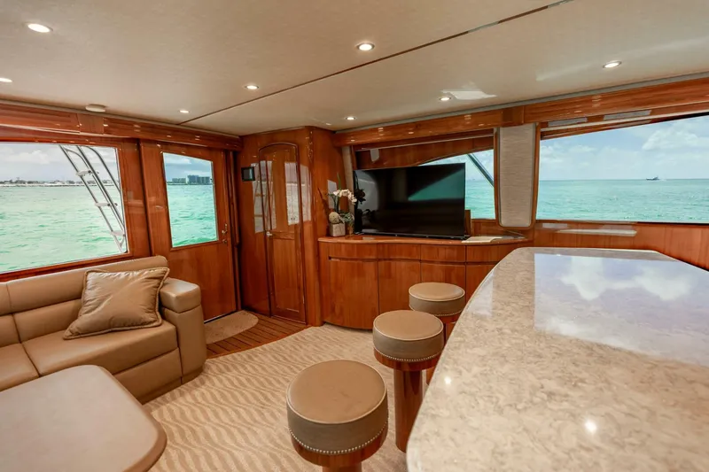 Miss Virginia Yacht Photos Pics Luxurious interior of 2017 Viking 66 Convertible yacht with ocean view and elegant furnishings.