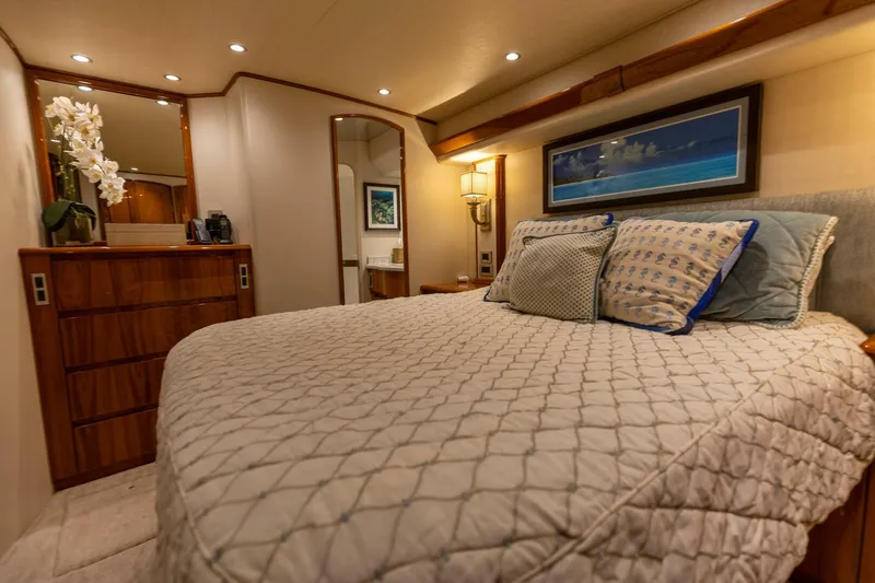Miss Virginia Yacht Photos Pics Luxurious bedroom interior of 2017 Viking 66 Convertible yacht with elegant decor and cozy bedding.
