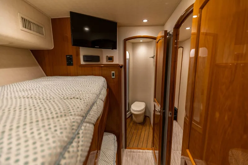 Miss Virginia Yacht Photos Pics Interior of 2017 Viking 66 Convertible yacht with bunk bed and bathroom.