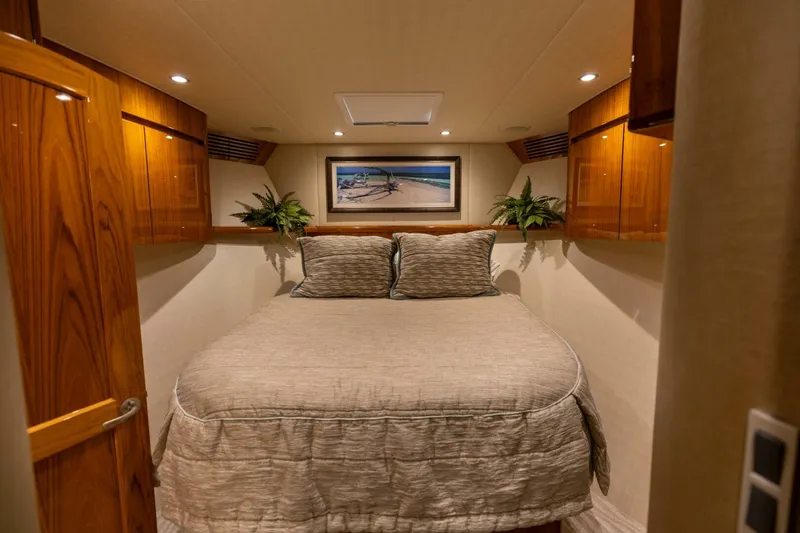 Miss Virginia Yacht Photos Pics Luxurious bedroom interior of 2017 Viking 66 Convertible yacht with elegant wood finishes.