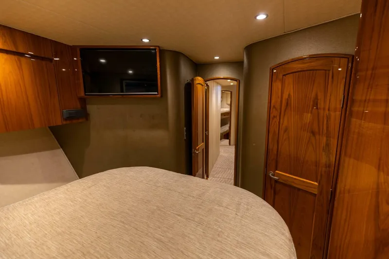 Miss Virginia Yacht Photos Pics Luxurious interior of 2017 Viking 66 Convertible yacht with wood finishes and modern amenities.