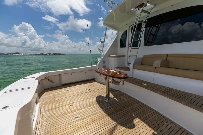 Miss Virginia Yacht Photos Pics 2017 Viking 66 Convertible yacht deck with seating, table, and ocean view.