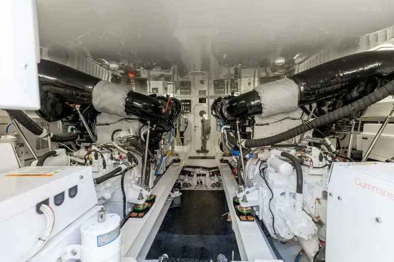 Miss Virginia Yacht Photos Pics Engine room of 2017 Viking 66 Convertible yacht, showcasing dual engines and mechanical systems.