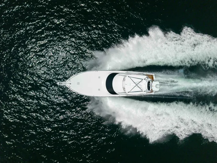 Miss Virginia Yacht Photos Pics Aerial view of 2017 Viking 66 Convertible yacht speeding on water.