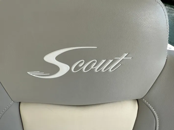 Giddy Up Yacht Photos Pics Scout 355 LXF CC 2019 boat seat with embroidered logo on gray leather.