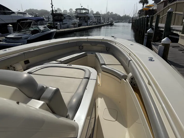 Giddy Up Yacht Photos Pics 2019 Scout 355 LXF CC boat docked, showcasing spacious seating and sleek design.
