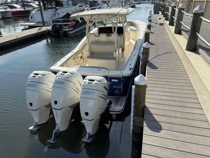 Giddy Up Yacht Photos Pics 2019 Scout 355 LXF CC boat docked with triple Yamaha 350 engines.