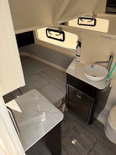 Giddy Up Yacht Photos Pics 2019 Scout 355 LXF CC cabin interior with bed, sink, and storage.