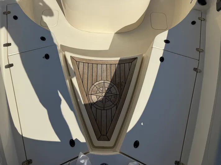 Giddy Up Yacht Photos Pics 2019 Scout 355 LXF CC boat deck with wood inlay design.