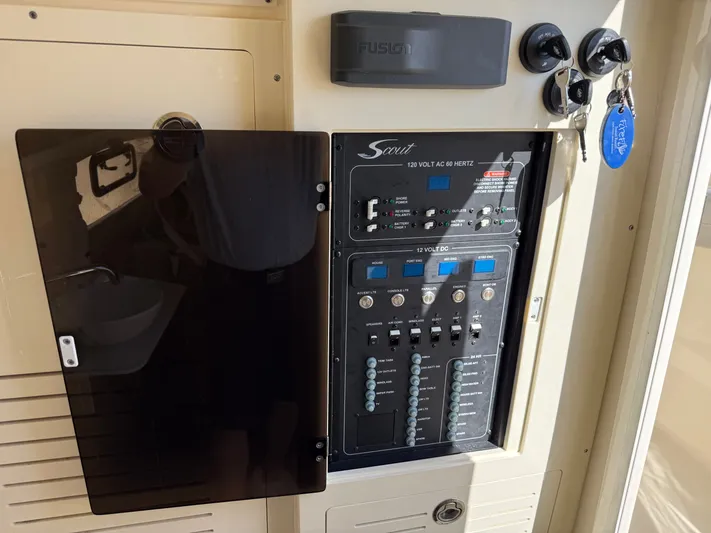 Giddy Up Yacht Photos Pics Control panel of a 2019 Scout 355 LXF CC boat with keys and switches.