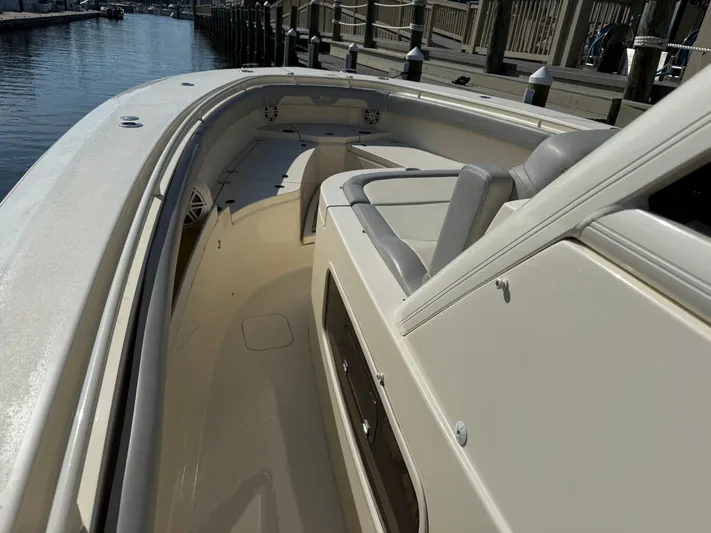 Giddy Up Yacht Photos Pics 2019 Scout 355 LXF CC boat interior with seating, docked by the water.
