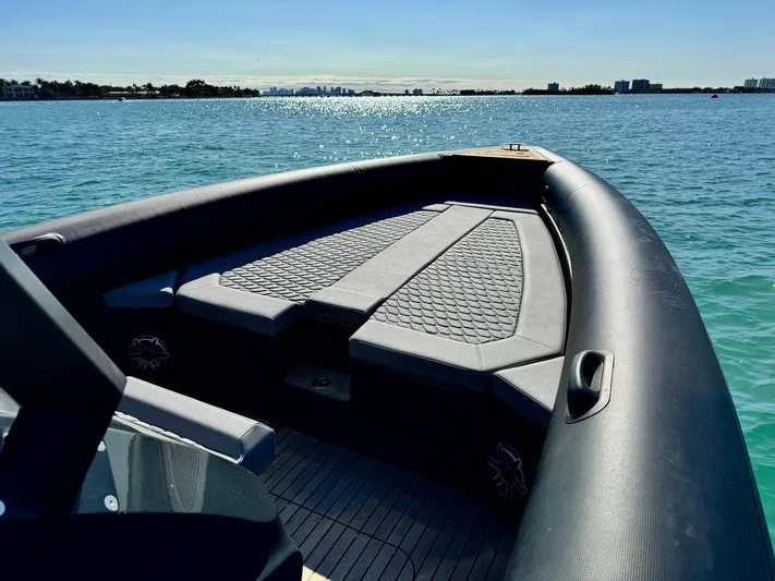 2025 Skipper 34 Twin 300 V8 Yacht Photos Pics 2025 Skipper-BSK 34 boat on calm water, showcasing sleek design and spacious deck.