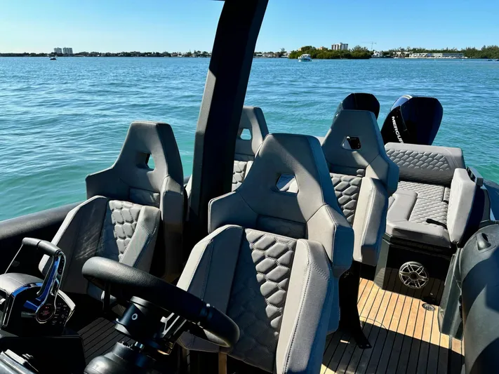 2025 Skipper 34 Twin 300 V8 Yacht Photos Pics 2025 Skipper-BSK 34 boat interior with modern seating on a sunny day at sea.